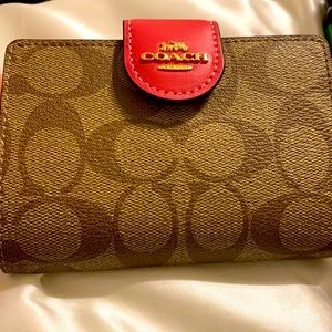 Coach wallet, with tags, strawberry color.
